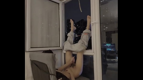 Teenager masturbates and cums in front of the window